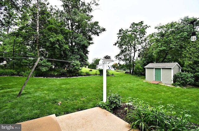 403 Grenoble Dr, Sellersville, PA 18960 - view of grassy yard featuring a storage shed