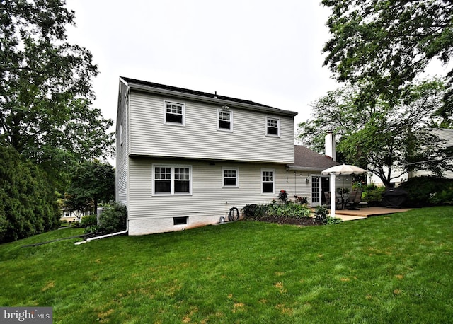 403 Grenoble Dr, Sellersville, PA 18960 - back of property with a yard, a patio area, and a chimney
