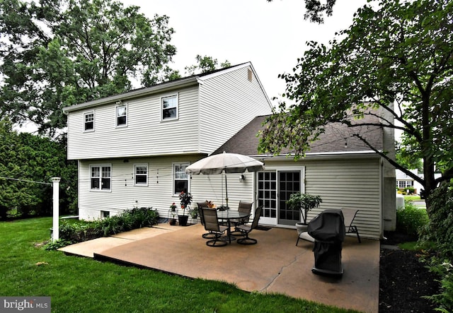 403 Grenoble Dr, Sellersville, PA 18960 - back of property featuring a yard, a patio, and a shingled roof