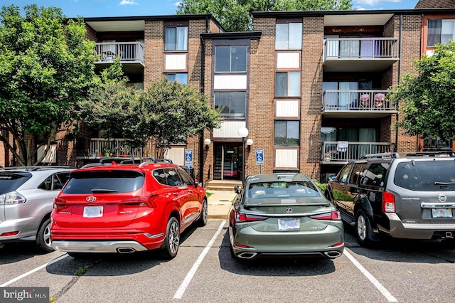 9720 Kingsbridge Dr Unit 302, Fairfax, VA 22031 - view of building exterior featuring uncovered parking