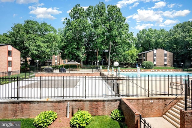 9720 Kingsbridge Dr Unit 302, Fairfax, VA 22031 - community pool featuring view of scattered trees