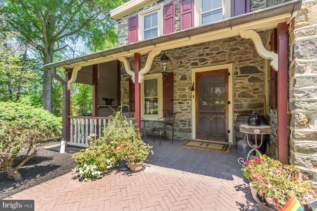 3150 Rushland Rd, Jamison, PA 18929 - doorway to property with stone siding and a porch