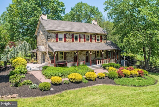 3150 Rushland Rd, Jamison, PA 18929 - view of front of property featuring stone siding, a chimney, covered porch, and a front yard