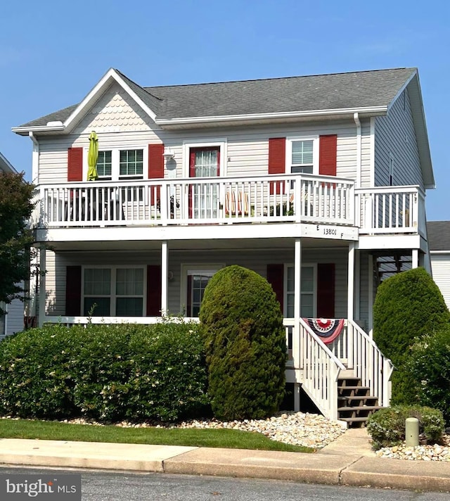 13801 Sand Dune Rd Unit E, Ocean City, MD 21842 - view of front facade featuring a balcony, covered porch, and roof with shingles