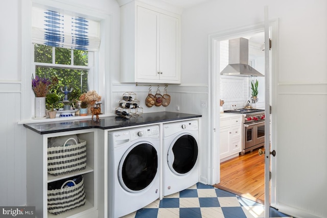 673 Ardmore Ave, Ardmore, PA 19003 - laundry room with independent washer and dryer, cabinet space, a decorative wall, and wainscoting