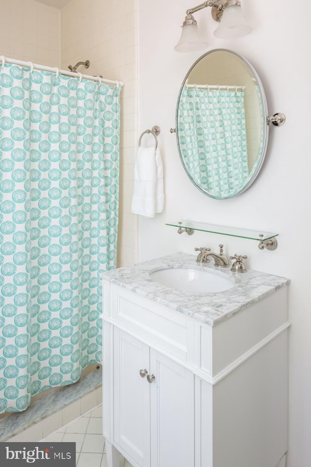 673 Ardmore Ave, Ardmore, PA 19003 - full bath with vanity, a shower with shower curtain, and tile patterned floors
