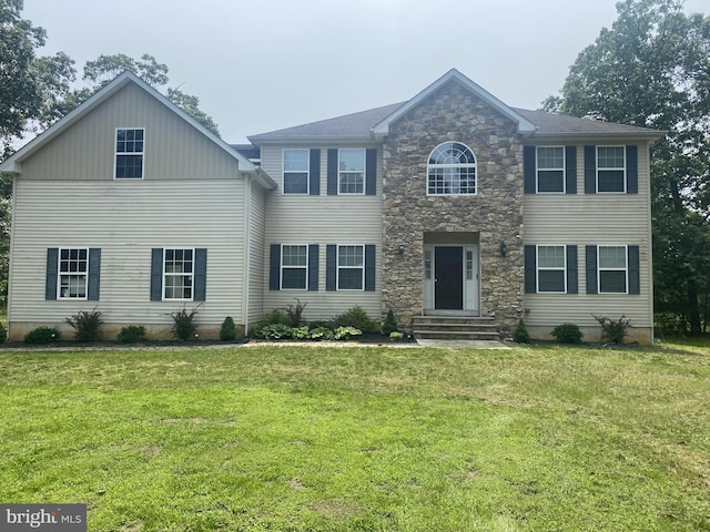 5 Sameera Ct, New Egypt, NJ 08533 - colonial house featuring stone siding, a front lawn, and entry steps