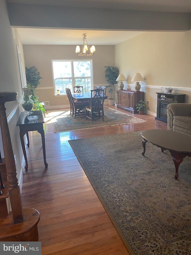 5 Sameera Ct, New Egypt, NJ 08533 - living area with a fireplace, a chandelier, and wood finished floors