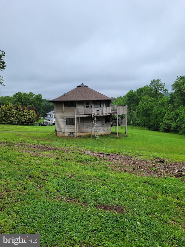 23 Shady Creek Ln, Mertztown, PA 19539 - rear view of property with a yard, a wooden deck, and a shingled roof