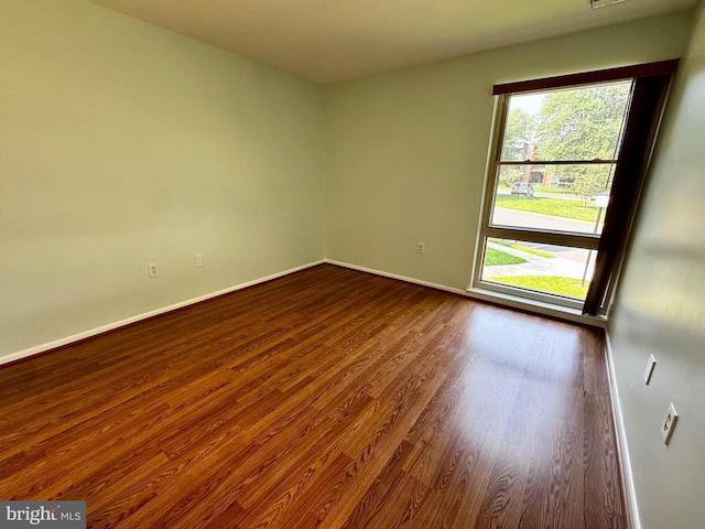 2200 Greenery Ln Unit 201-, Silver Spring, MD 20906 - unfurnished room with healthy amount of natural light and dark wood-style floors