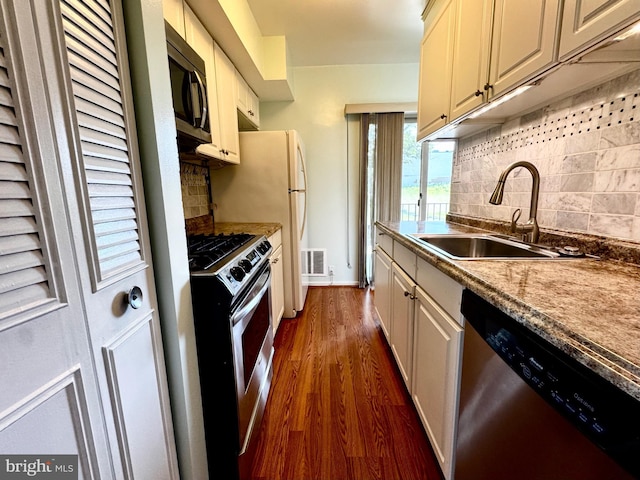 2200 Greenery Ln Unit 201-, Silver Spring, MD 20906 - kitchen featuring stainless steel appliances, dark wood-style floors, backsplash, and cream cabinets