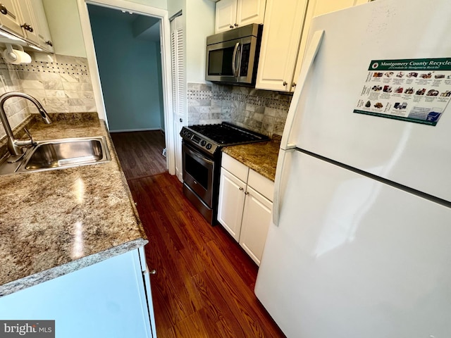 2200 Greenery Ln Unit 201-, Silver Spring, MD 20906 - kitchen featuring stainless steel appliances, dark wood-type flooring, backsplash, and white cabinets