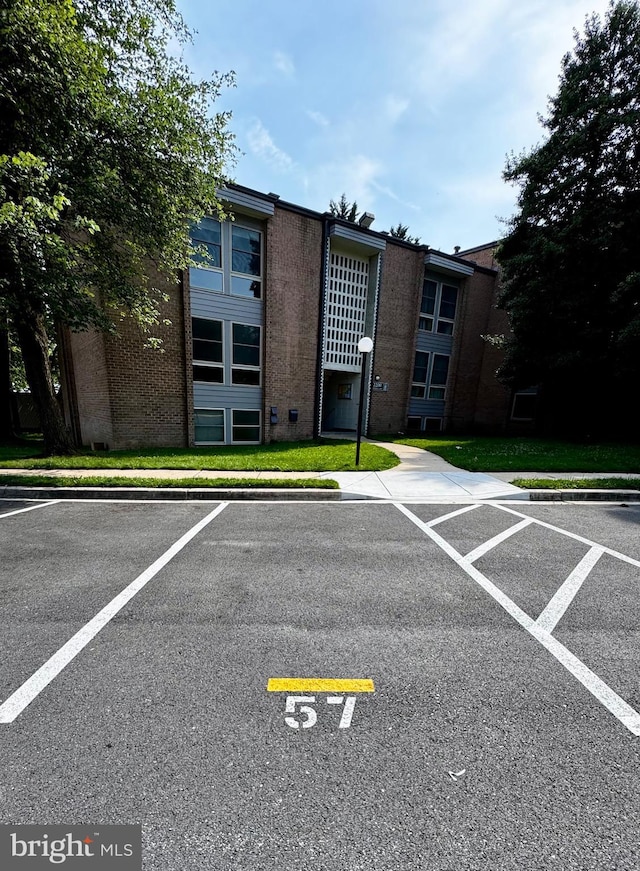 2200 Greenery Ln Unit 201-, Silver Spring, MD 20906 - view of building exterior with uncovered parking