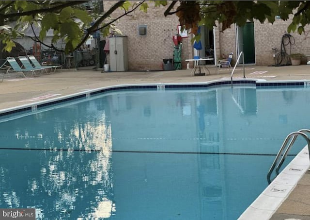 2200 Greenery Ln Unit 201-, Silver Spring, MD 20906 - community pool featuring a patio