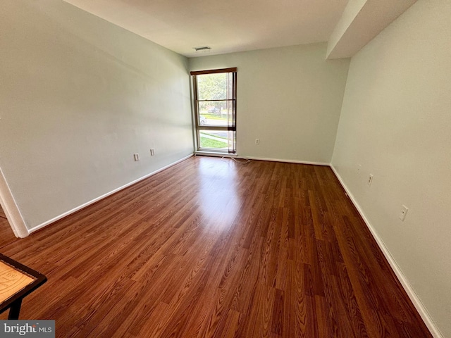 2200 Greenery Ln Unit 201-, Silver Spring, MD 20906 - unfurnished room featuring wood finished floors and baseboards