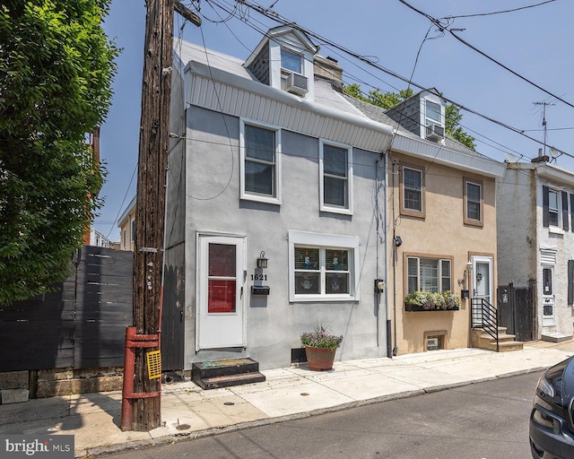 1621 E Hewson St, Philadelphia, PA 19125 - view of property featuring stucco siding, entry steps, and cooling unit