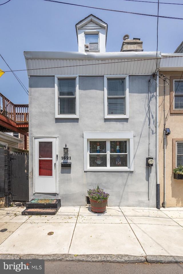 1621 E Hewson St, Philadelphia, PA 19125 - view of front of property featuring a chimney and stucco siding