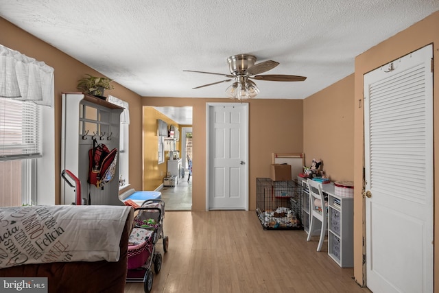 1621 E Hewson St, Philadelphia, PA 19125 - bedroom featuring light wood-style floors, a textured ceiling, and ceiling fan