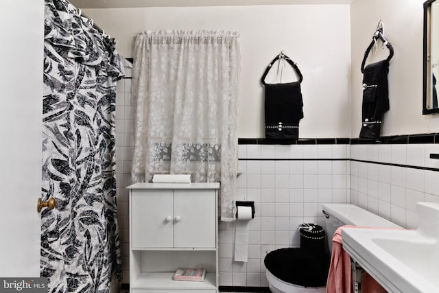 6602 8th Ave, Hyattsville, MD 20783 - full bathroom with tile walls, a shower with shower curtain, and wainscoting