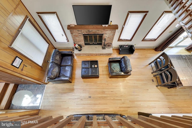138 Banbury Dr, Bushkill, PA 18324 - unfurnished living room featuring wood finished floors and a brick fireplace