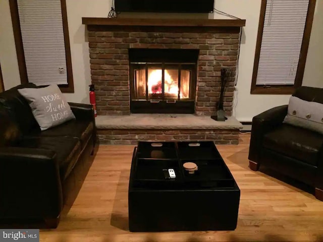 138 Banbury Dr, Bushkill, PA 18324 - living room with wood finished floors, baseboard heating, and a fireplace