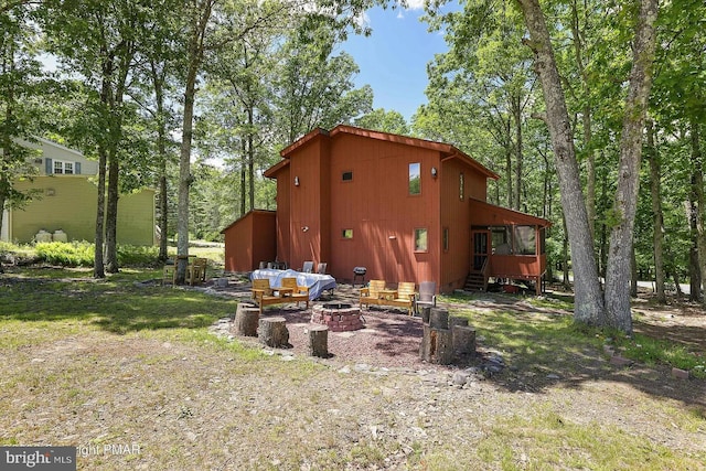 138 Banbury Dr, Bushkill, PA 18324 - rear view of property with a fire pit