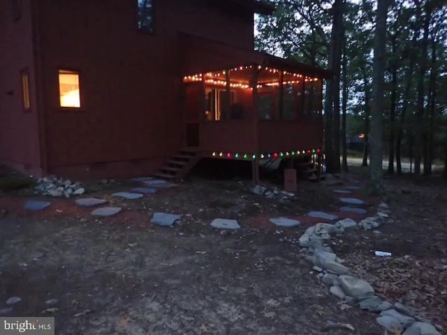 138 Banbury Dr, Bushkill, PA 18324 - view of home's exterior with a sunroom and stairs