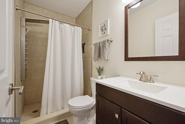 1917 H St NE, Washington, DC 20002 - bathroom featuring vanity, toilet, and a tile shower