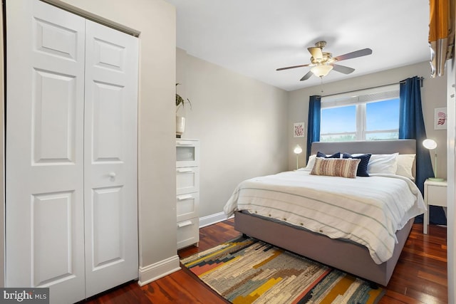1917 H St NE, Washington, DC 20002 - bedroom with dark wood-style floors, baseboards, ceiling fan, and a closet