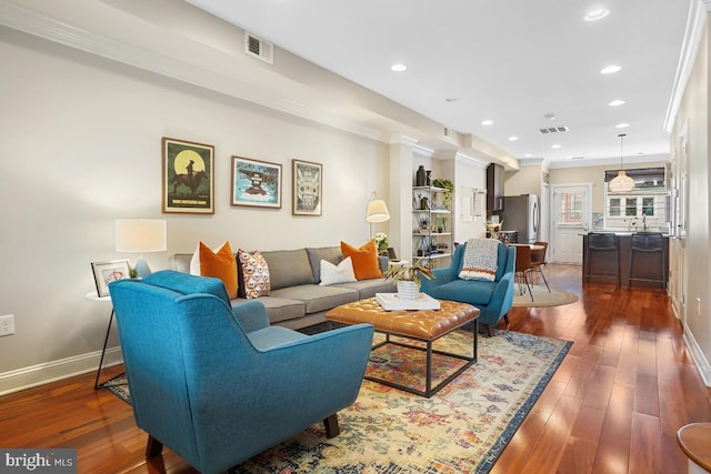 1917 H St NE, Washington, DC 20002 - living room with baseboards, wood finished floors, recessed lighting, and crown molding