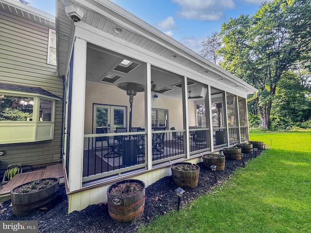 14371 Bristow Rd, Manassas, VA 20112 - view of property exterior featuring a yard, a sunroom, and a surveillance system