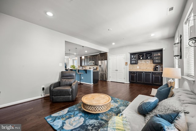 7444 Saint Margarets Blvd Unit A, Hanover, MD 21076 - living room featuring bar, dark wood-style flooring, and recessed lighting