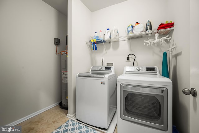 7444 Saint Margarets Blvd Unit A, Hanover, MD 21076 - laundry area featuring washer and clothes dryer, electric water heater, and light tile patterned flooring