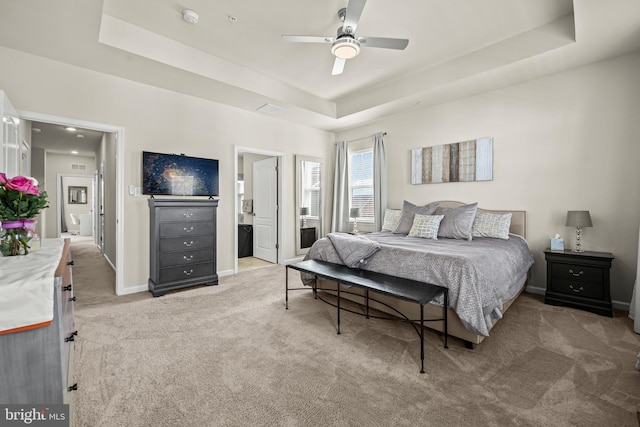 7444 Saint Margarets Blvd Unit A, Hanover, MD 21076 - bedroom featuring a tray ceiling, light colored carpet, and ceiling fan