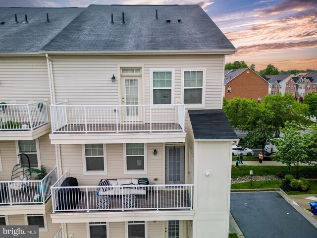 7444 Saint Margarets Blvd Unit A, Hanover, MD 21076 - back of house featuring a balcony and a shingled roof