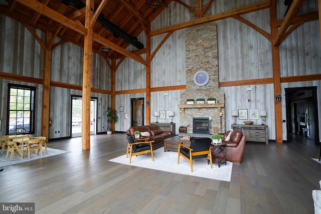 7444 Saint Margarets Blvd Unit A, Hanover, MD 21076 - living area featuring high vaulted ceiling, a fireplace, wood finished floors, and beamed ceiling