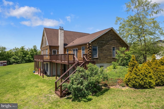 7600 Pohopoco Dr, Kunkletown, PA 18058 - back of property with log siding, a deck, stairway, a lawn, and a chimney