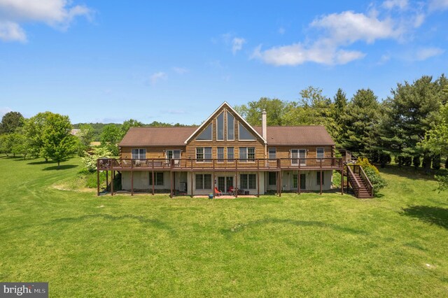 7600 Pohopoco Dr, Kunkletown, PA 18058 - rear view of house featuring a wooden deck, stairs, a lawn, log exterior, and view of wooded area