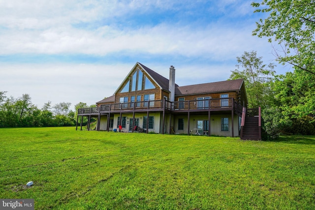 7600 Pohopoco Dr, Kunkletown, PA 18058 - back of property featuring a wooden deck, stairway, and a lawn