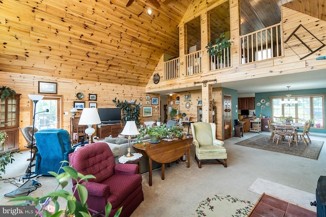 7600 Pohopoco Dr, Kunkletown, PA 18058 - carpeted living room featuring wooden ceiling, high vaulted ceiling, and wood walls