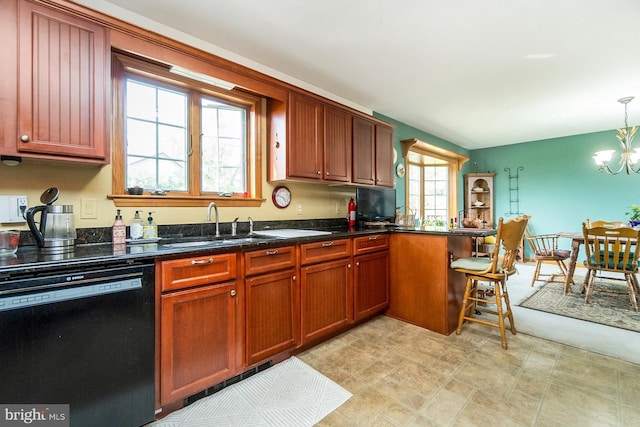 7600 Pohopoco Dr, Kunkletown, PA 18058 - kitchen featuring dishwasher, a chandelier, a sink, pendant lighting, and dark stone counters