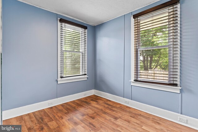 229 E Canal St, Hershey, PA 17033 - unfurnished room featuring wood finished floors and a textured ceiling