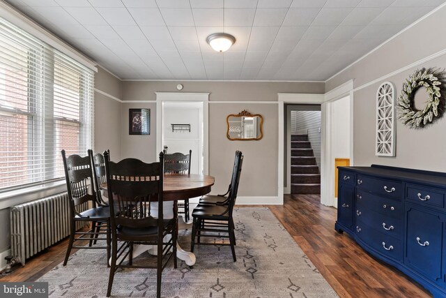 229 E Canal St, Hershey, PA 17033 - dining area with radiator heating unit, stairway, and dark wood-style flooring