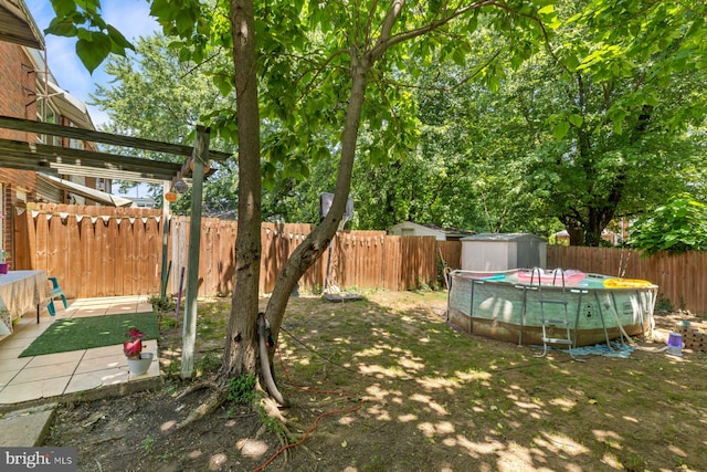 3109 Bero Rd, Halethorpe, MD 21227 - fenced backyard with a storage unit and a patio