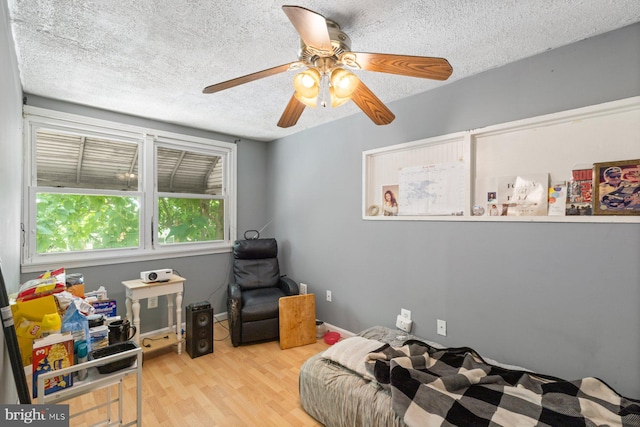 3109 Bero Rd, Halethorpe, MD 21227 - bedroom with a textured ceiling, wood finished floors, and ceiling fan