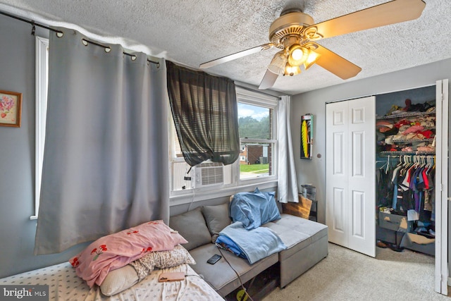 3109 Bero Rd, Halethorpe, MD 21227 - carpeted bedroom featuring a textured ceiling, a closet, cooling unit, and a ceiling fan