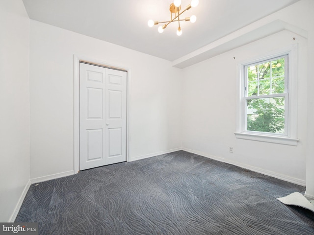 408 Summit Ave, Fort Washington, PA 19034 - unfurnished bedroom with a chandelier, dark carpet, and a closet