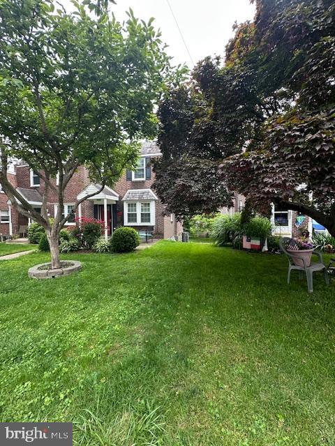 710 Wildell Rd Unit 108, Drexel Hill, PA 19026 - view of front of house featuring a front yard and brick siding