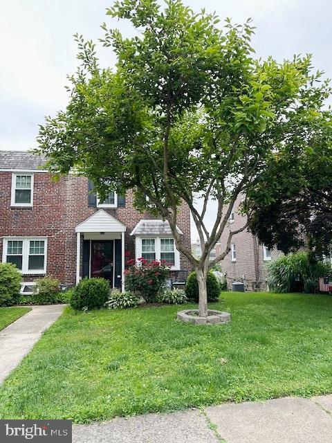 710 Wildell Rd Unit 108, Drexel Hill, PA 19026 - view of front of property with brick siding and a front lawn