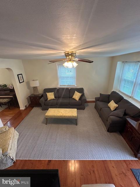 710 Wildell Rd Unit 108, Drexel Hill, PA 19026 - living area featuring a ceiling fan, arched walkways, and wood finished floors